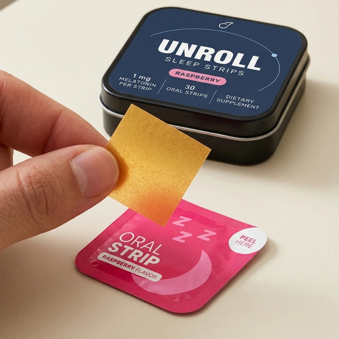 Unroll raspberry sleep strips tin, packet and paper-thin amber strip held in hand