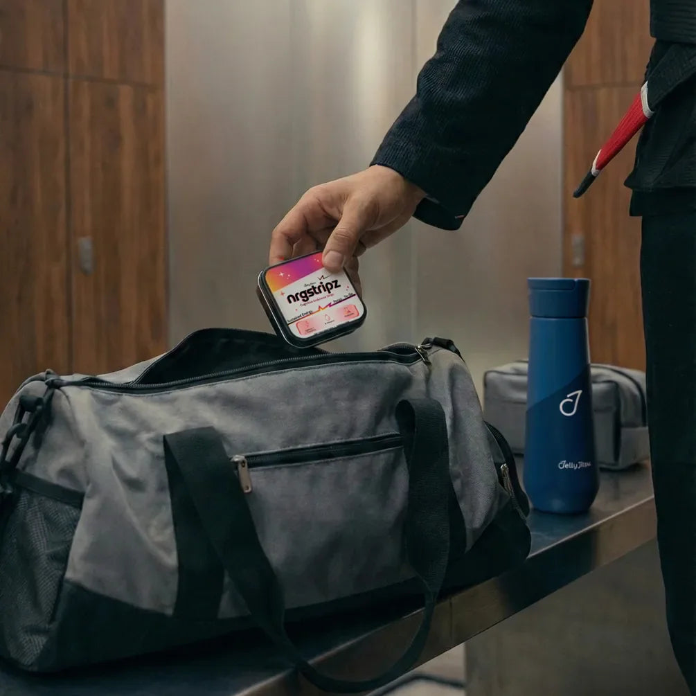 Athlete packing Tomorrow's Starter Kit into a Jiu-Jitsu gym bag